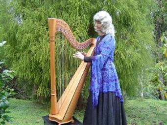 Photo of Susannte playing Harp in her Garden
