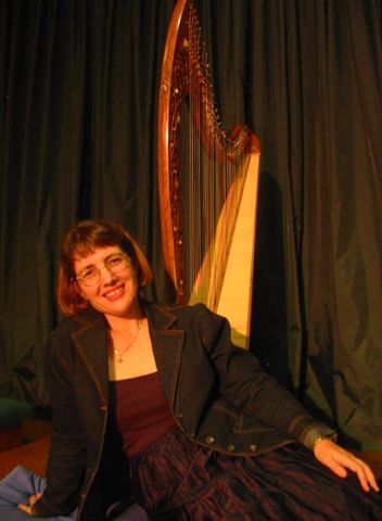 Robyn Goudge relaxing infront of harp